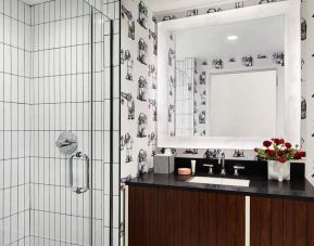 Private guest bathroom with shower at Graduate New York.