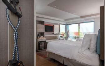 Delux king room with TV and work desk at Even Hotel Brooklyn.