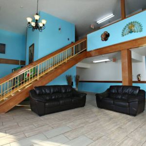 Lobby area at Coratel Inn & Suites By Jasper Newton.