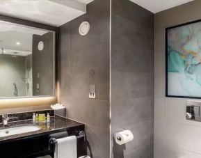 Private guest bathroom with shower at Hilton Garden Inn London Heathrow Terminals 2 And 3.