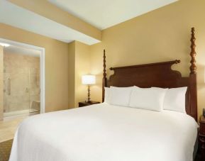 King bedroom with private bathroom at Embassy Suites By Hilton Savannah.