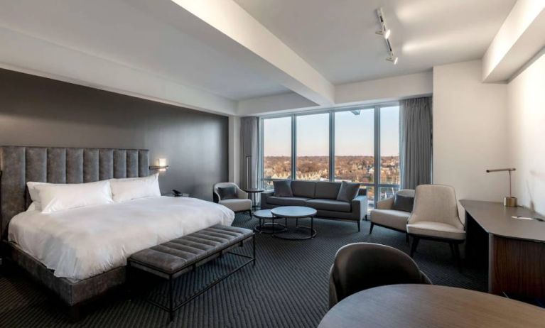 Day use room with sofa, work desk and dining table at Hotel Chauncey.
