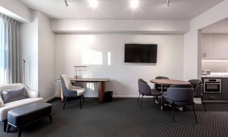 Workspace and dining table inside day use room at Hotel Chauncey.