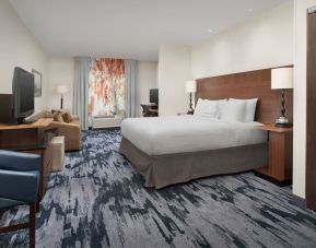 King bedroom with TV and work space at Fairfield Inn & Suites by Marriott Baltimore BWI Airport.