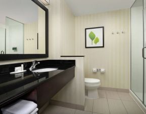 Private guest bathroom at Fairfield Inn & Suites by Marriott Baltimore BWI Airport.