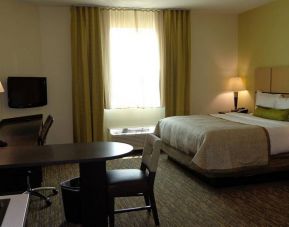 Day use room with work desk and kitchen at Candlewood Suites Odessa.