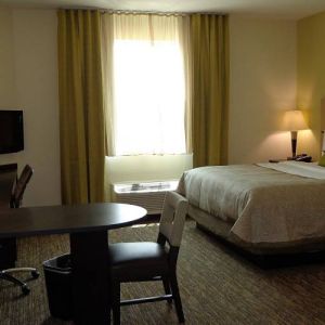 Day use room with work desk and kitchen at Candlewood Suites Odessa.