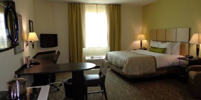 Day use room with work desk and kitchen at Candlewood Suites Odessa.