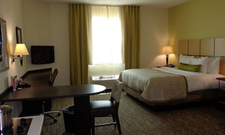 Day use room with work desk and kitchen at Candlewood Suites Odessa.