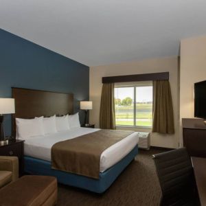 Day use room with work desk and sofa at AmericInn By Wyndham Sioux Falls North.