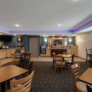 Dining area at AmericInn By Wyndham Sioux Falls North.