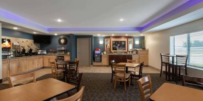Dining area at AmericInn By Wyndham Sioux Falls North.