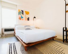 Delux king room with natural light at Selina Chelsea New York City.