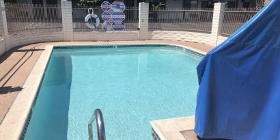 Refreshing outdoor pool at Cozy Inn.