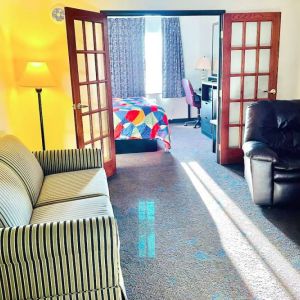 Day use room with living area at Coratel Inn & Suites By Jasper Northfield.
