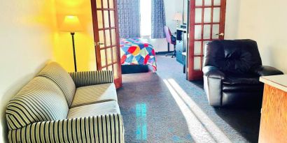 Day use room with living area at Coratel Inn & Suites By Jasper Northfield.