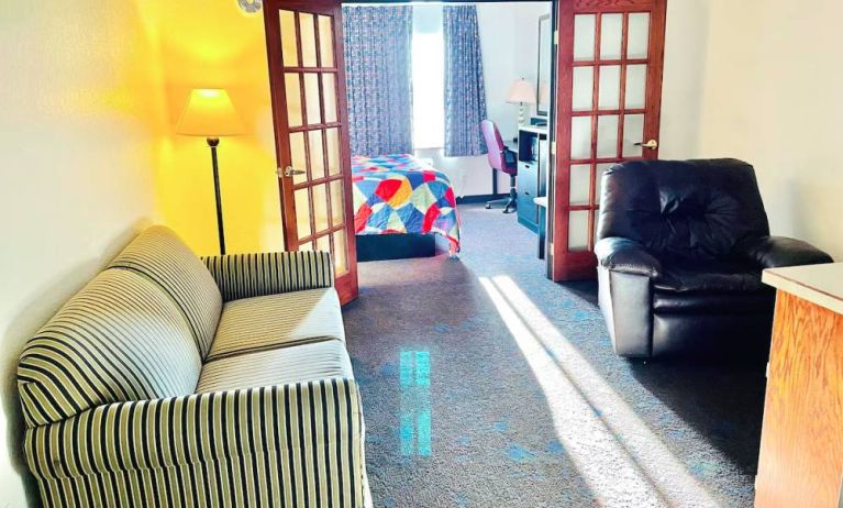Day use room with living area at Coratel Inn & Suites By Jasper Northfield.