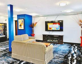 Lobby and coworking lounge at Coratel Inn & Suites By Jasper Northfield.