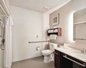 Private guest bathroom with shower at Homewood Suites By Hilton Dallas-Lewisville.