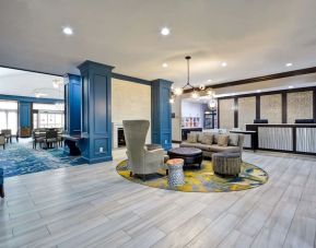 Lobby and coworking space at Homewood Suites By Hilton Dallas-Lewisville.
