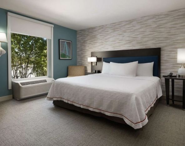 Delux king bed with natural light at Home2 Suites By Hilton Charleston Airport/Convention Center.