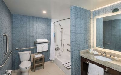 Guest bathroom with shower and tub at Homewood Suites By Hilton Miami Airport-Blue Lagoon.