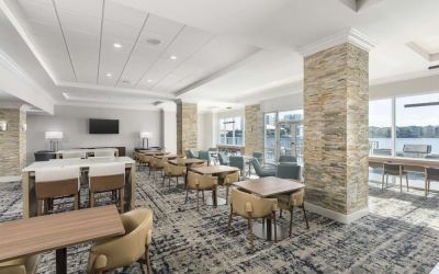 Lobby and coworking lounge at Homewood Suites By Hilton Miami Airport-Blue Lagoon.