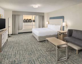 Delux king bed with work desk at Homewood Suites By Hilton Miami Airport-Blue Lagoon.