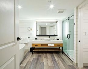 Private guest bathroom with shower at The Inn At Saratoga, Tapestry Collection By Hilton.