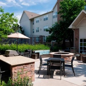 Fire pit and BBQ grill area at Residence Inn By Marriott Denver Highlands Ranch.