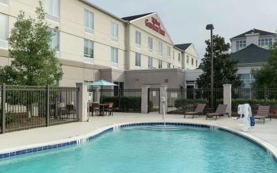 Stunning outdoor pool with pool chairs at Hilton Garden Inn Dothan.