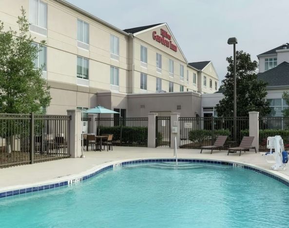 Stunning outdoor pool with pool chairs at Hilton Garden Inn Dothan.