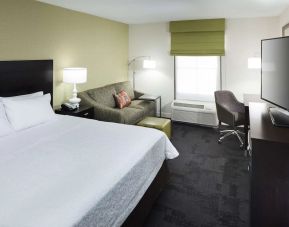 Day use room with work desk and natural light at Hampton Inn & Suites Gainesville-Downtown.