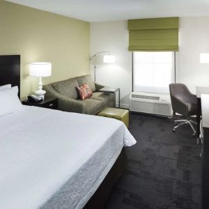 Day use room with work desk and natural light at Hampton Inn & Suites Gainesville-Downtown.
