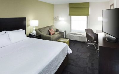 Day use room with work desk and natural light at Hampton Inn & Suites Gainesville-Downtown.