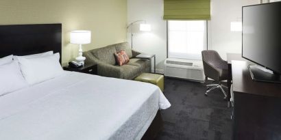 Day use room with work desk and natural light at Hampton Inn & Suites Gainesville-Downtown.
