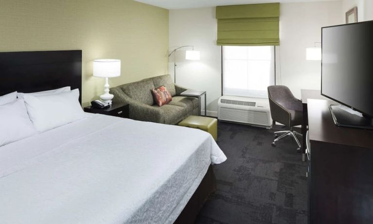 Day use room with work desk and natural light at Hampton Inn & Suites Gainesville-Downtown.