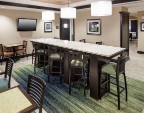 Dining and coworking space at Hampton Inn & Suites Gainesville-Downtown.