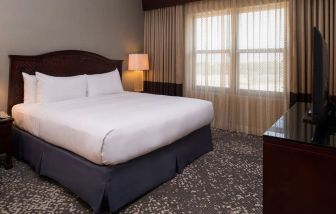 Delux king room with natural light at Hilton San Antonio Hill Country.