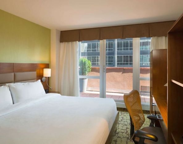 Delux king room with natural light at Hilton Garden Inn New York/Manhattan-Midtown East.