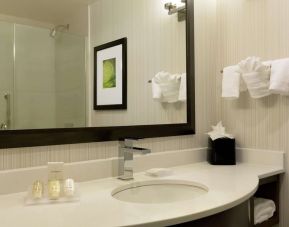 Guest bathroom with shower at Hilton Garden Inn New York/Manhattan-Midtown East.