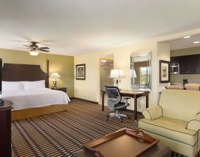 King bed with TV and work station at Homewood Suites By Hilton Lafayette-Airport, LA.