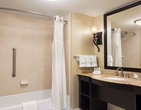 Guest bathroom with shower and bath at Homewood Suites By Hilton Lafayette-Airport, LA.
