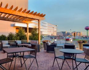 Lovely outdoor terrace and coworking space at Hampton Inn & Suites Rosemont Chicago O'Hare.