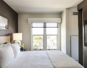 King bed with natural light at Hyatt Place Charleston - Historic District.