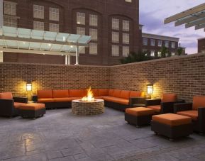 Outdoor fire pit and lounge area ideal for coworking at Hyatt Place Charleston - Historic District.