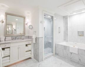 Guest bathroom with shower and bath at The Charleston Place.