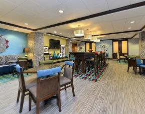 Dining and coworking space at Hampton Inn Iowa City/University Area.