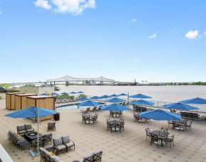 Lovely outdoor terrace and coworking space at Hilton Baton Rouge Capitol Center.