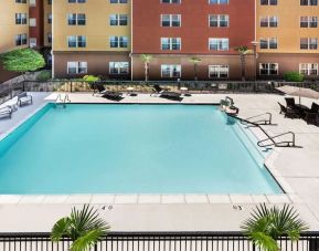 Relaxing outdoor pool and seating area at Homewood Suites By Hilton Shreveport.